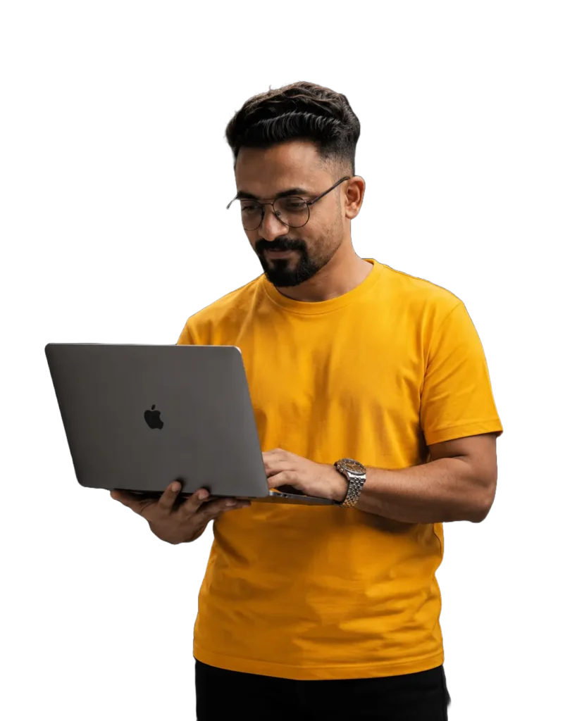 Irshad, a digital marketer in Kerala, working on a laptop
